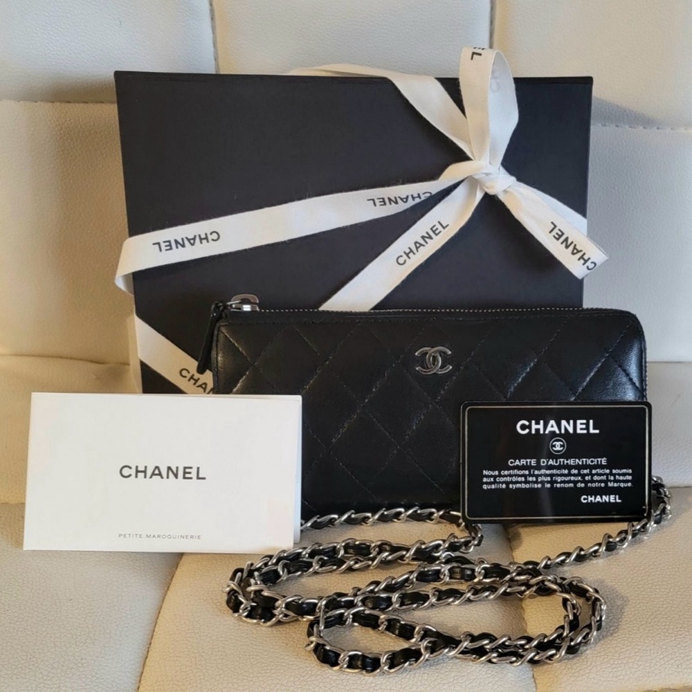 CHANEL Black Lambskin Quilted
Zippy Wallet on Chain